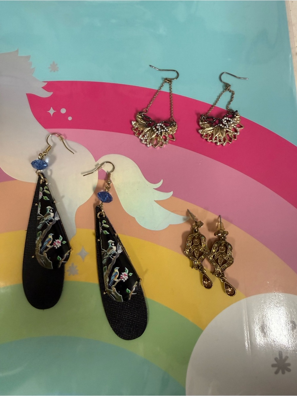 Three pairs of fun dangly earrings